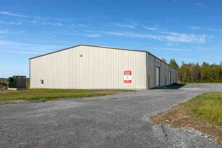 a white building with a red sign